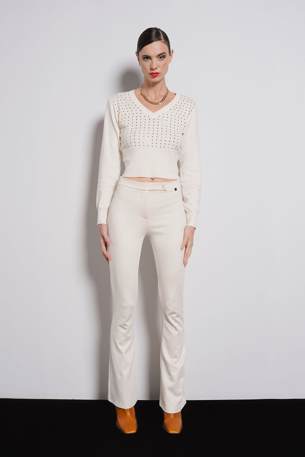 Pantalone zampa bottone gioiello