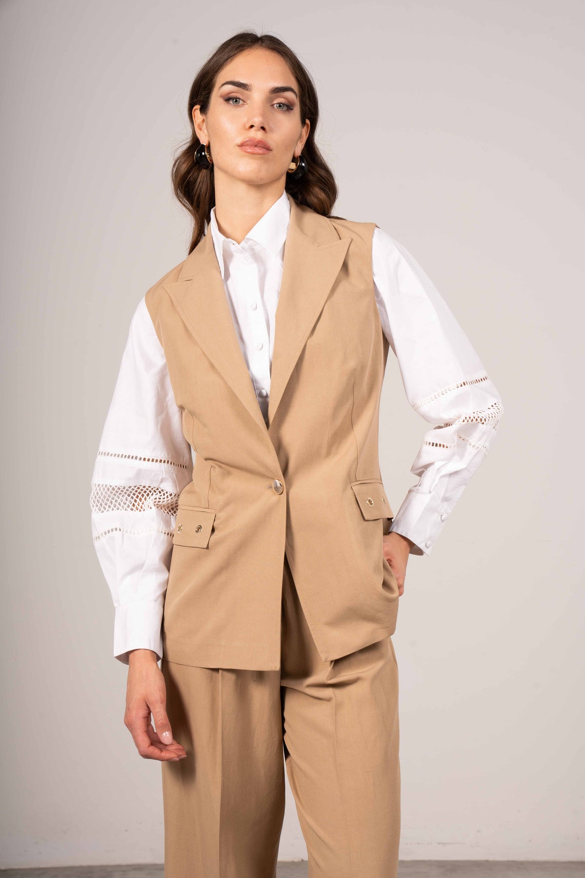 Gilet con occhielli
