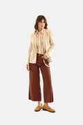 Pantalone palazzo con accessorio