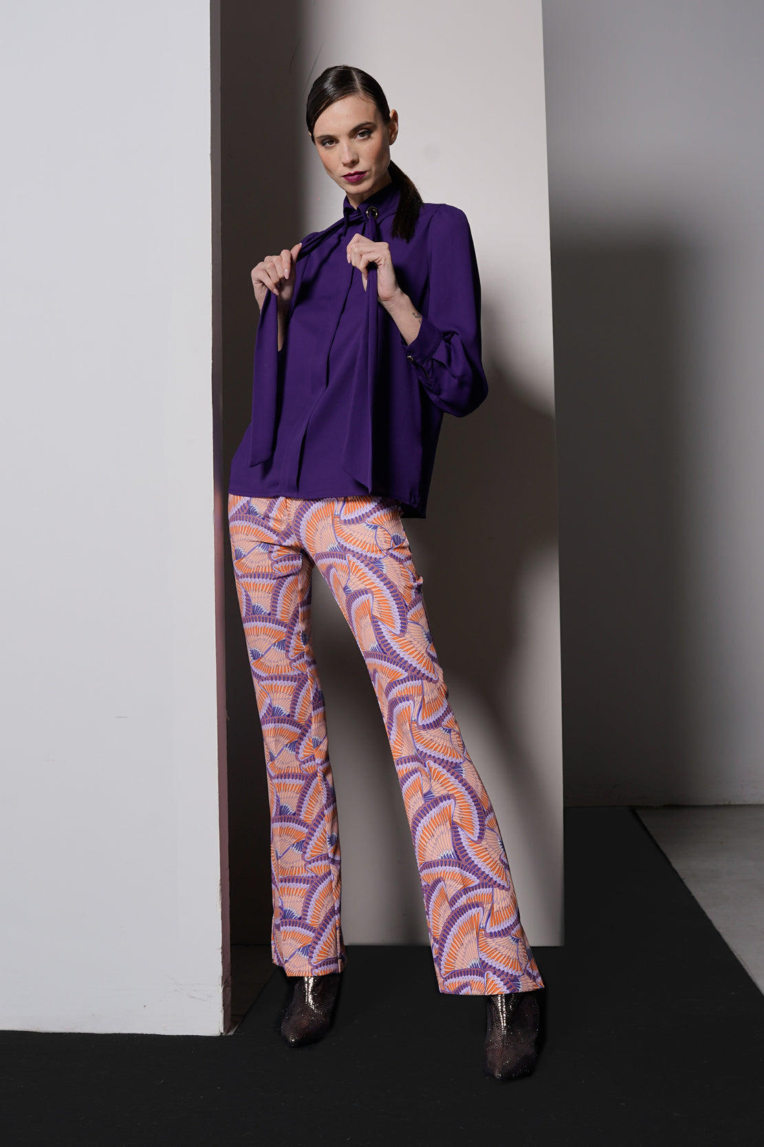 Blusa con occhielli