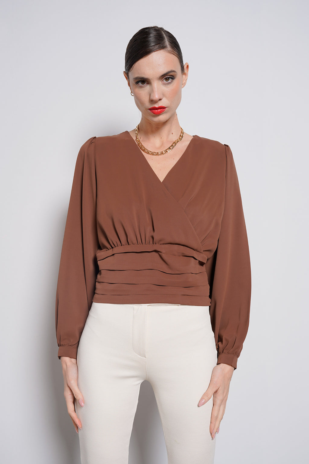 Blusa con fascione
