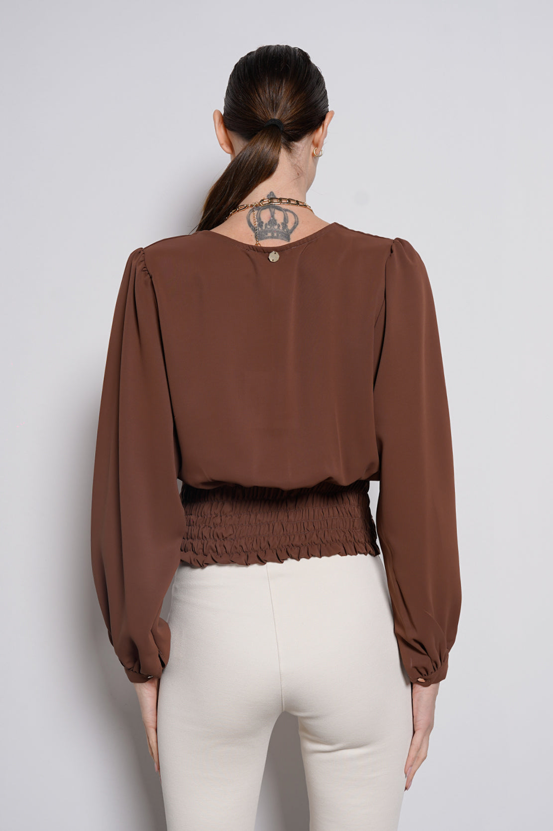 Blusa con fascione