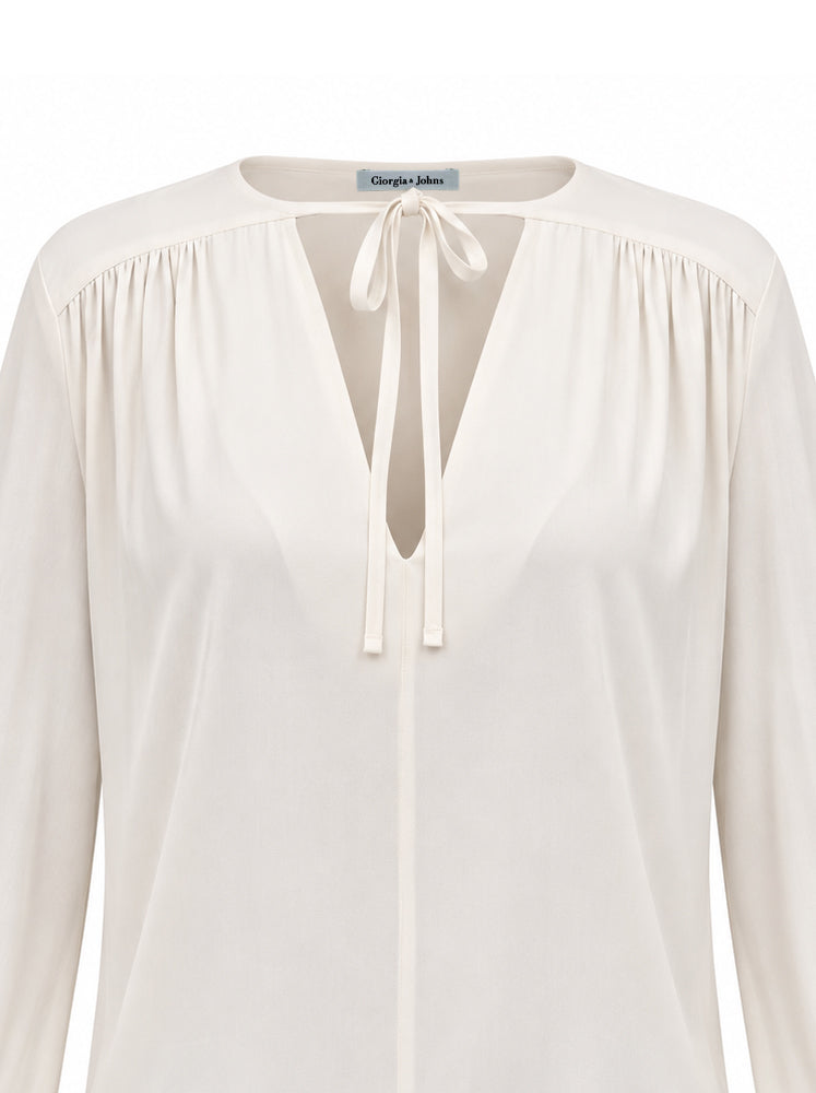 Blusa fluida con laccetti