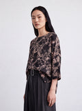 Blusa over stampa astratta