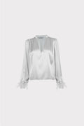 Blusa con piume
