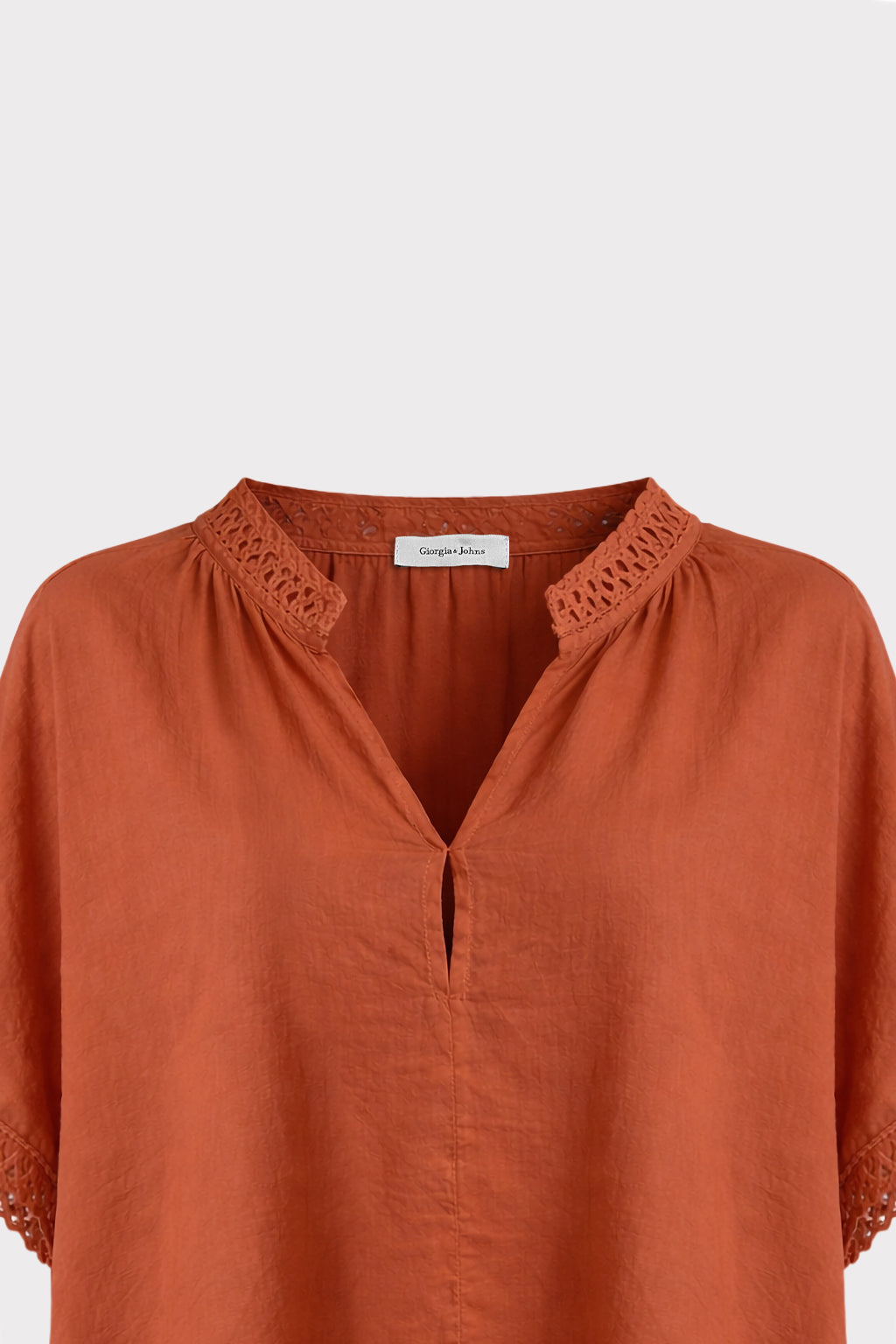 Blusa con passamaneria