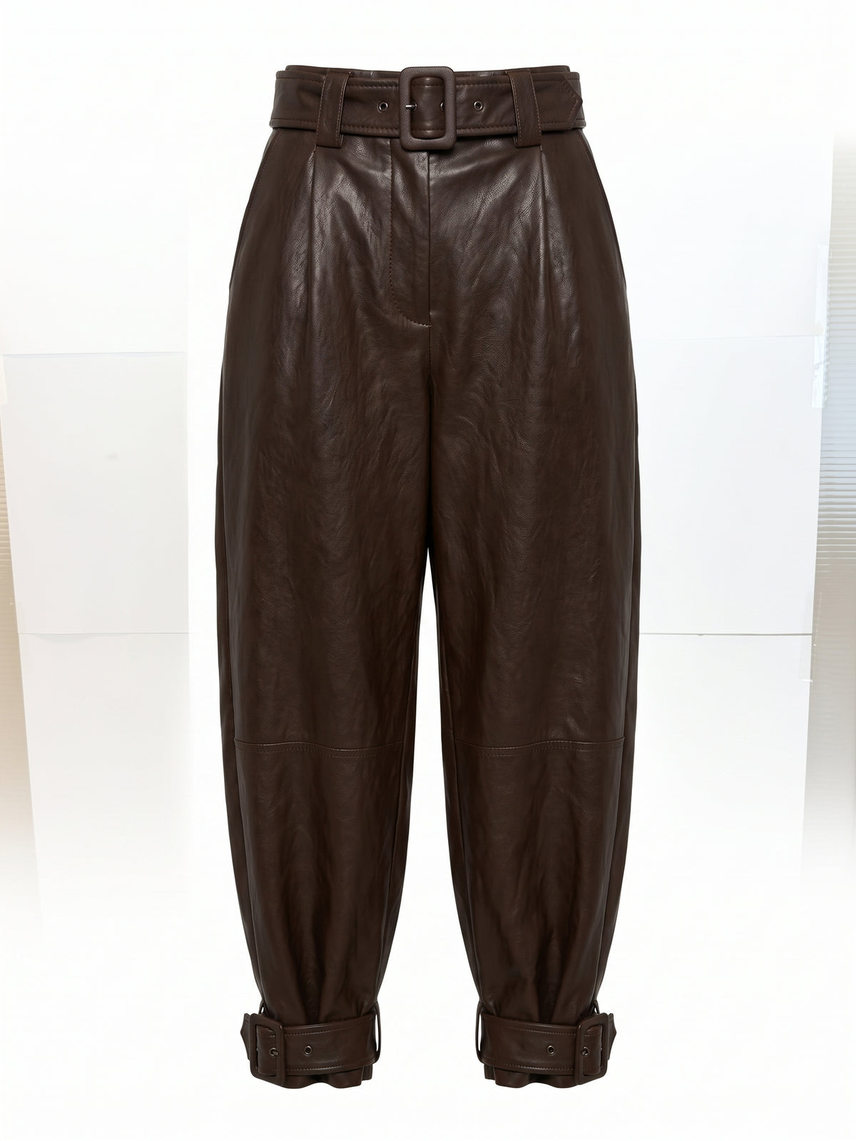 Pantaloni ecopelle con fibbie alla caviglia