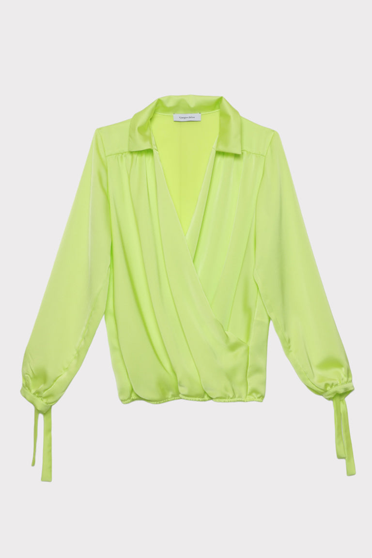 Blusa con polsi fiocco