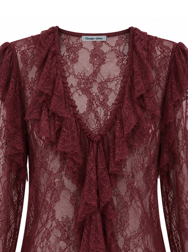 Blusa in pizzo con volants