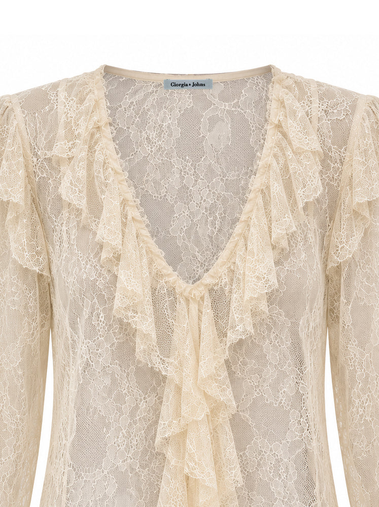 Blusa in pizzo con volants