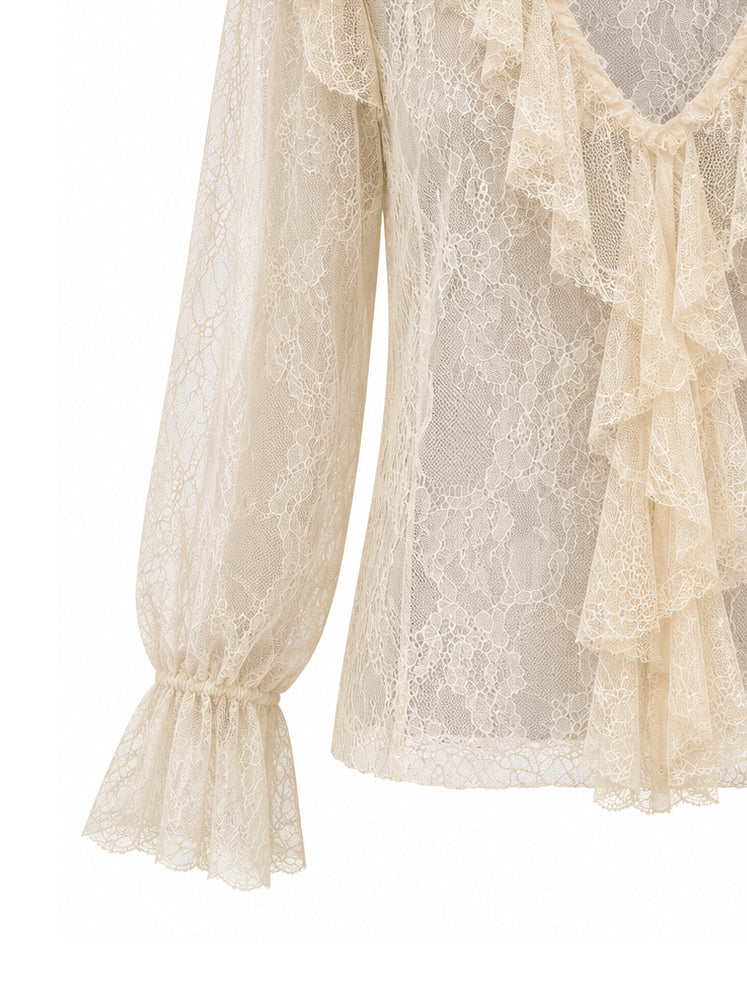 Blusa in pizzo con volants