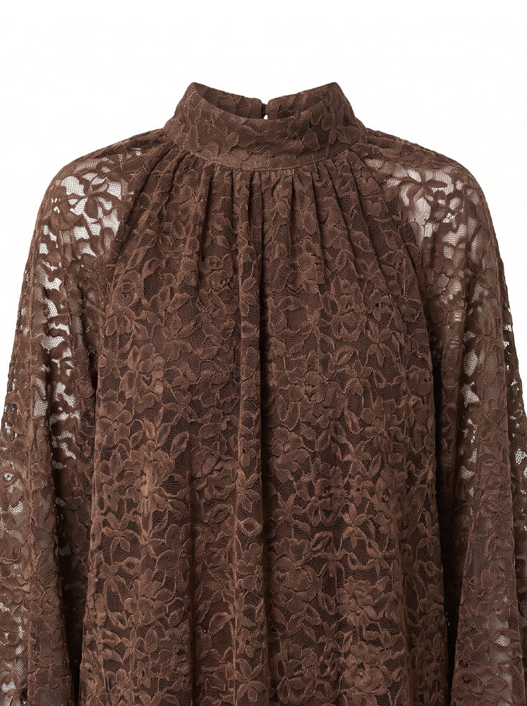 Blusa in pizzo collo alto