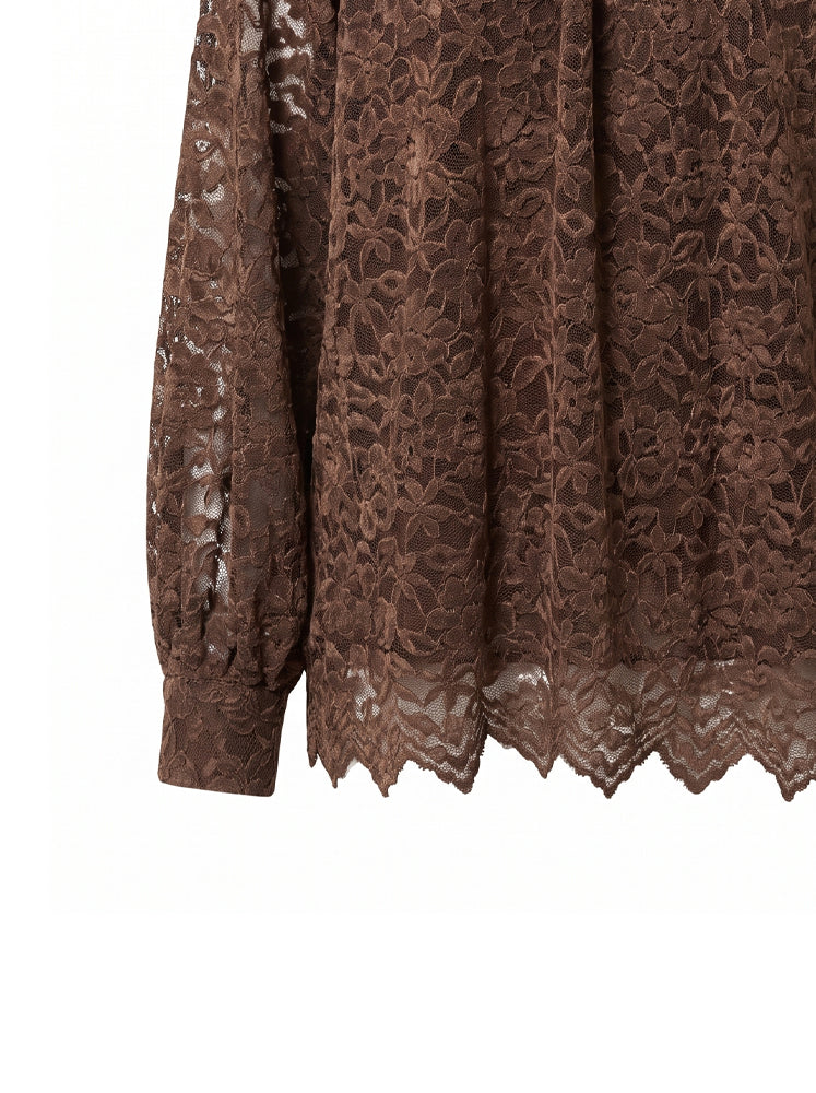 Blusa in pizzo collo alto