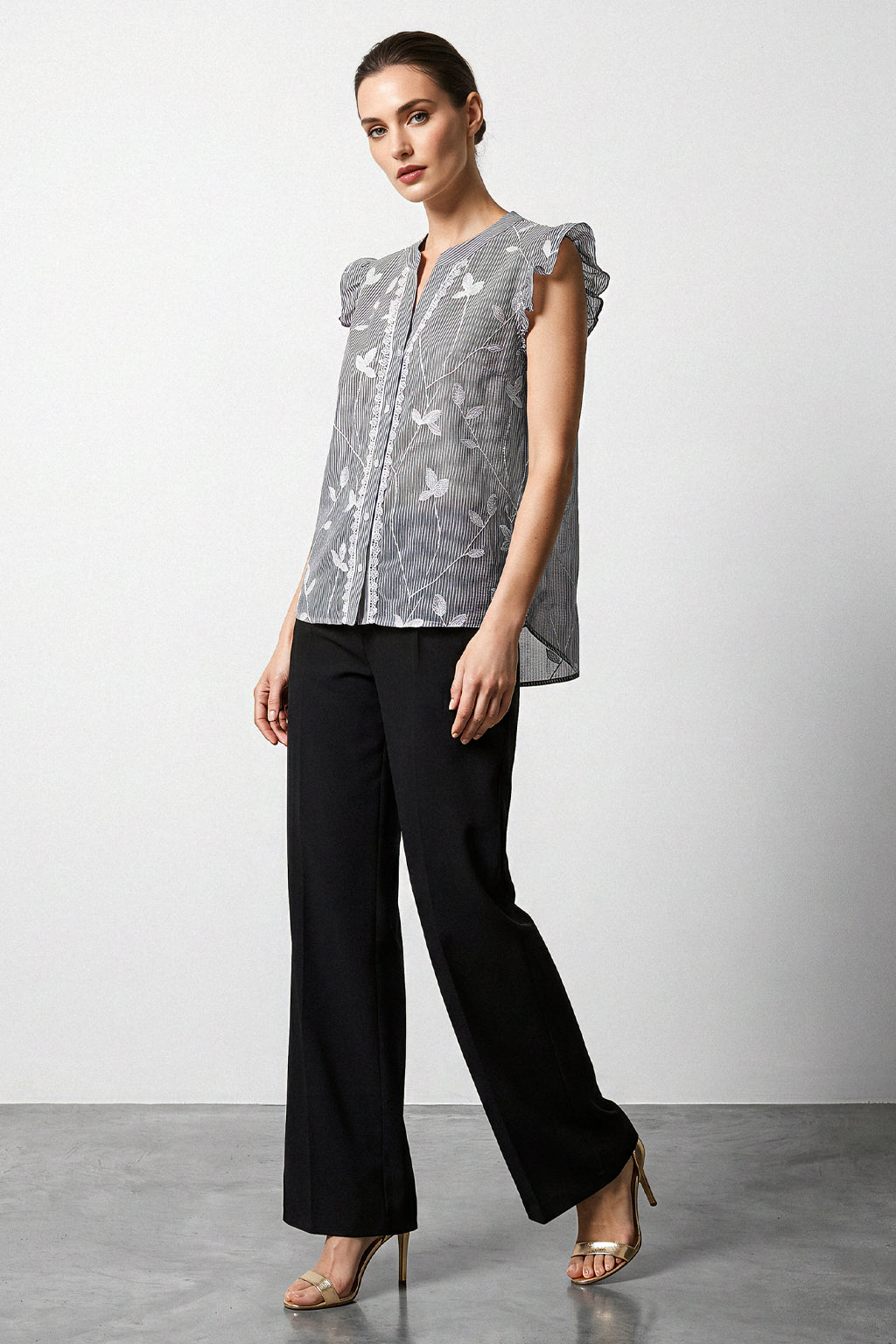 Blusa smanicata righe con rouches