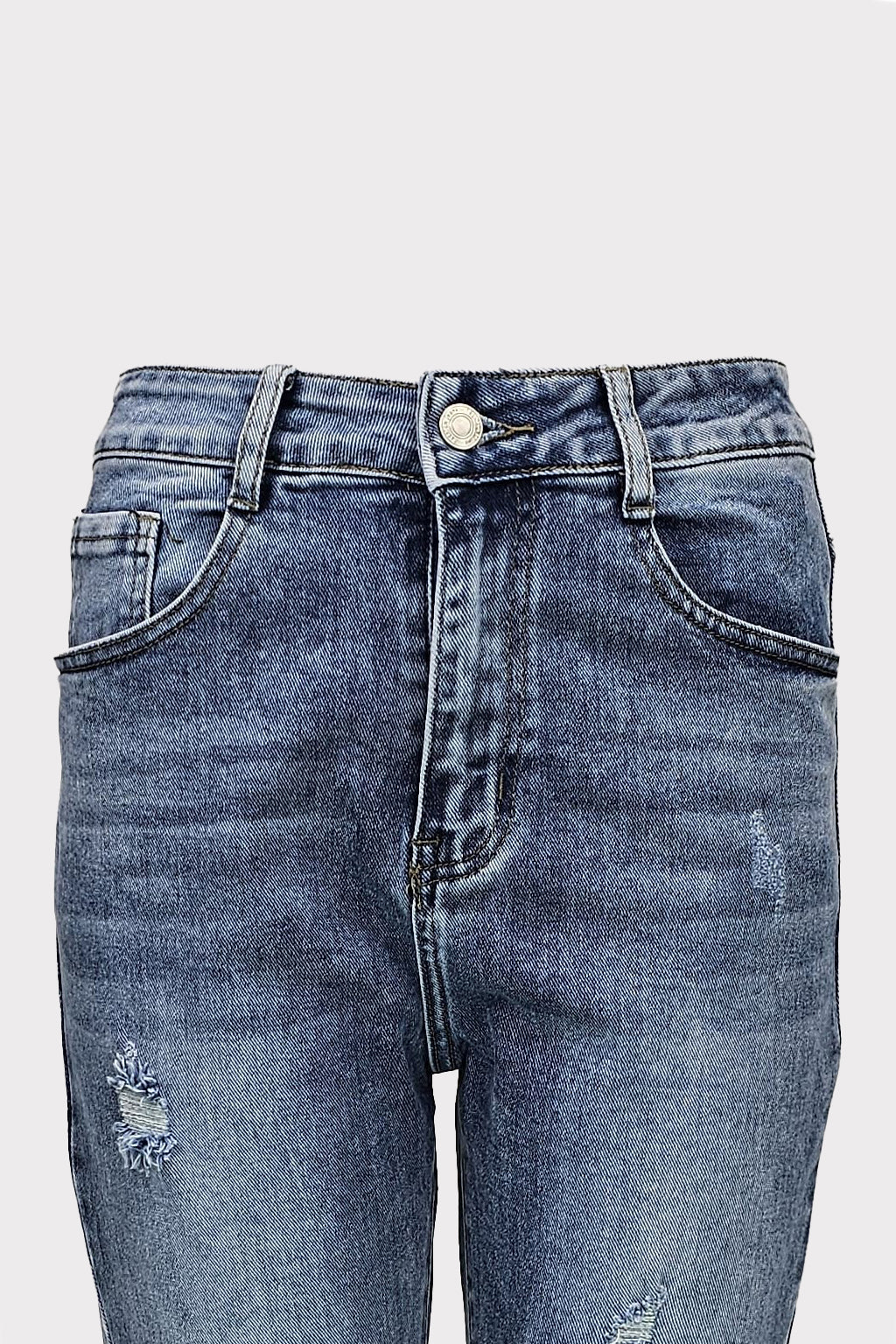Jeans mom fit con rotture