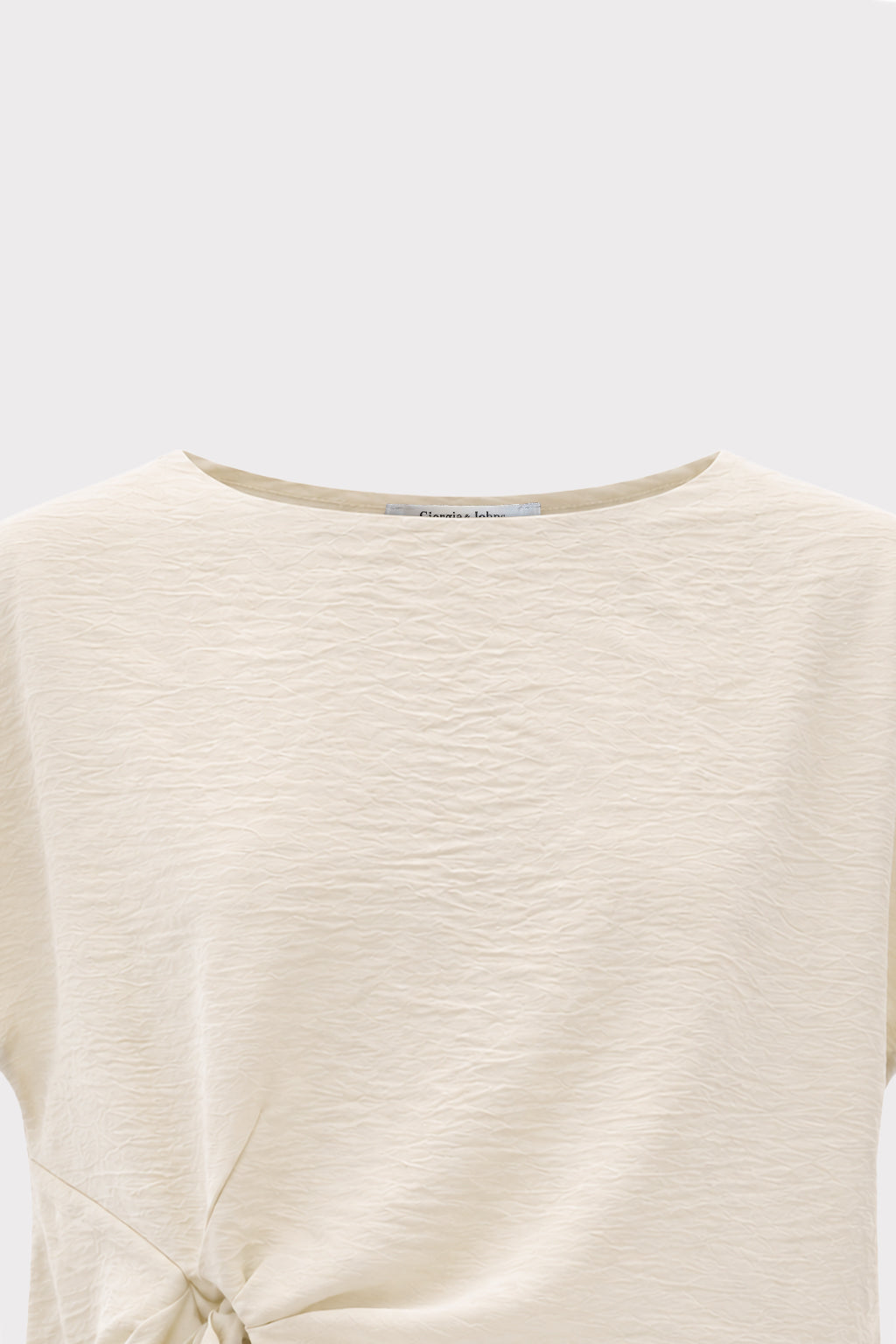 Blusa smanicata con nodo