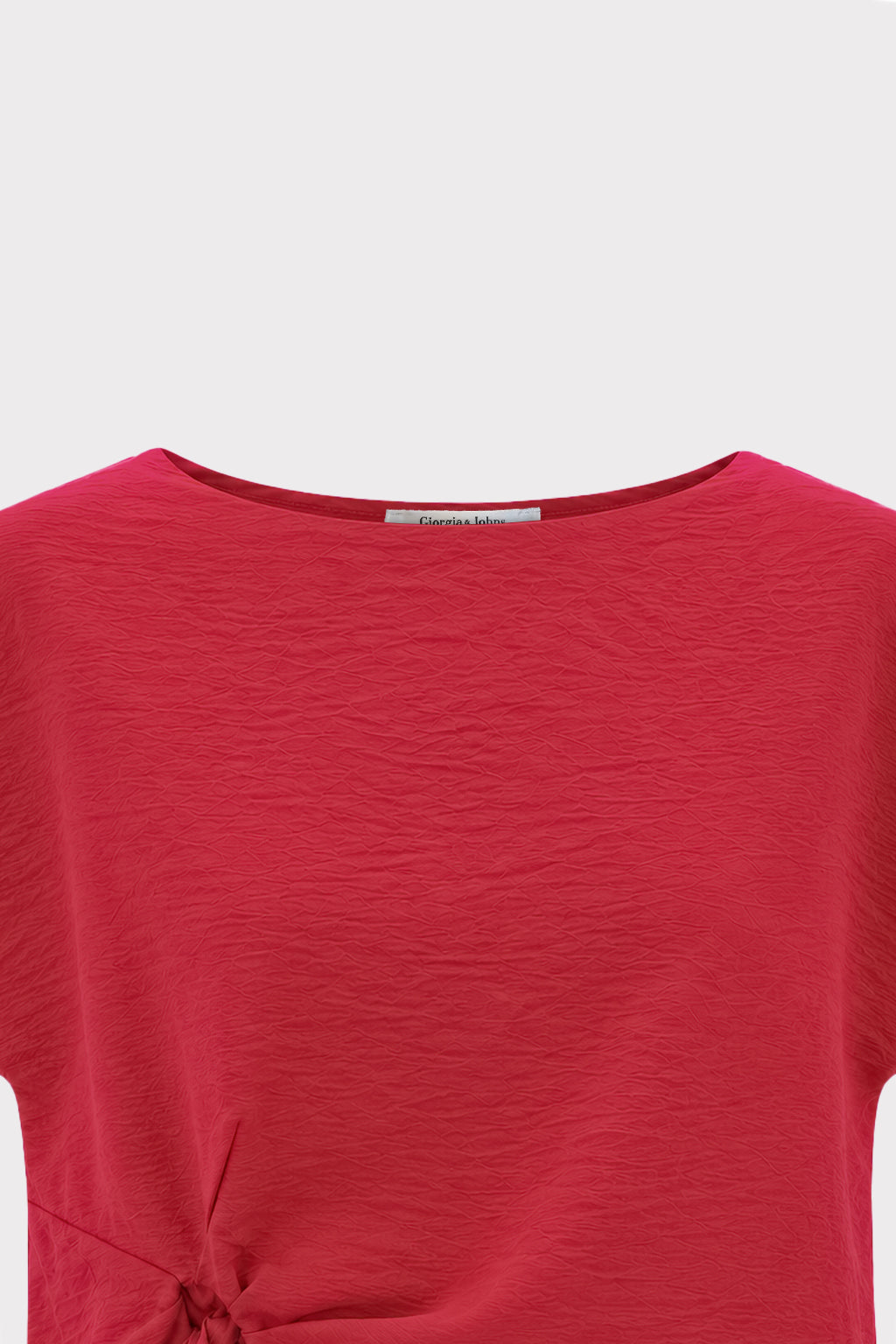 Blusa smanicata con nodo