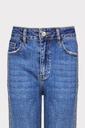 Jeans banda strass