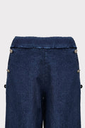 Jeans con bottoni fiori