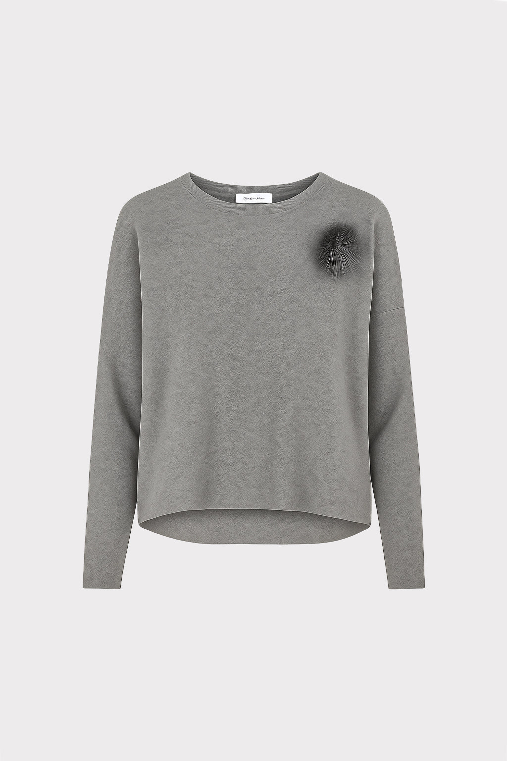 Pullover con spilla
