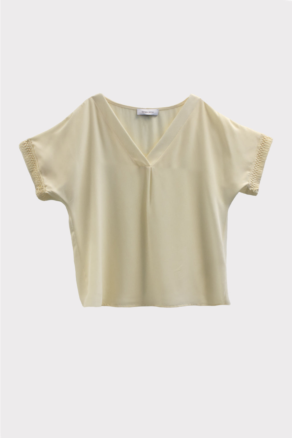 Blusa con passamaneria