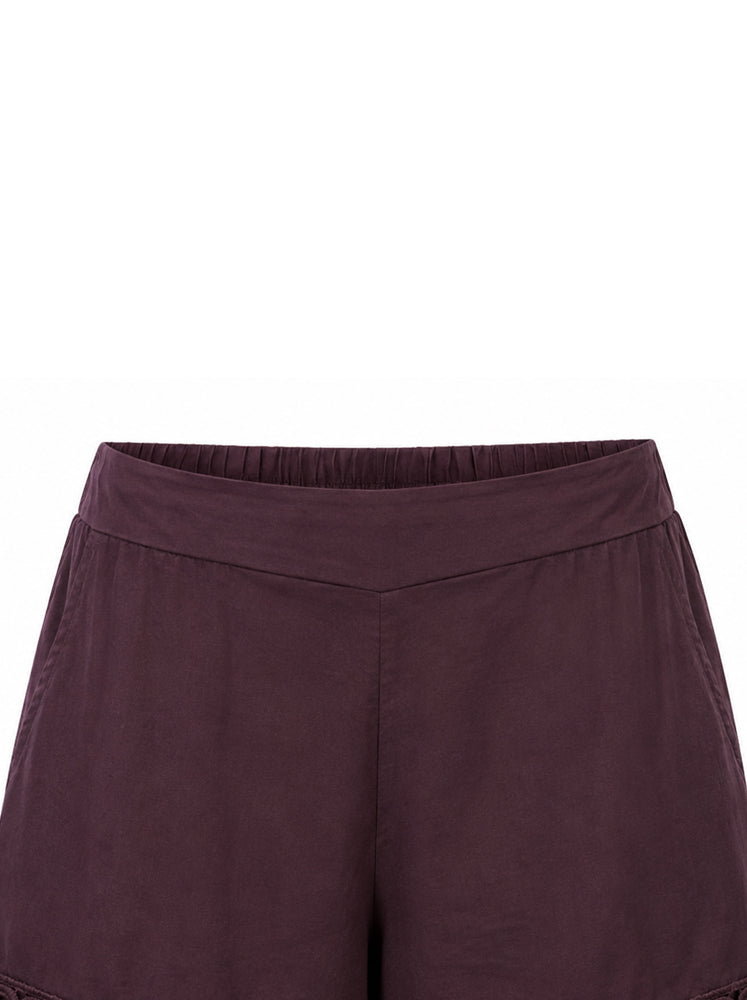 Shorts con passamaneria