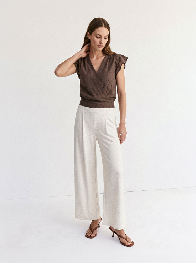 Blusa incrociata in sangallo