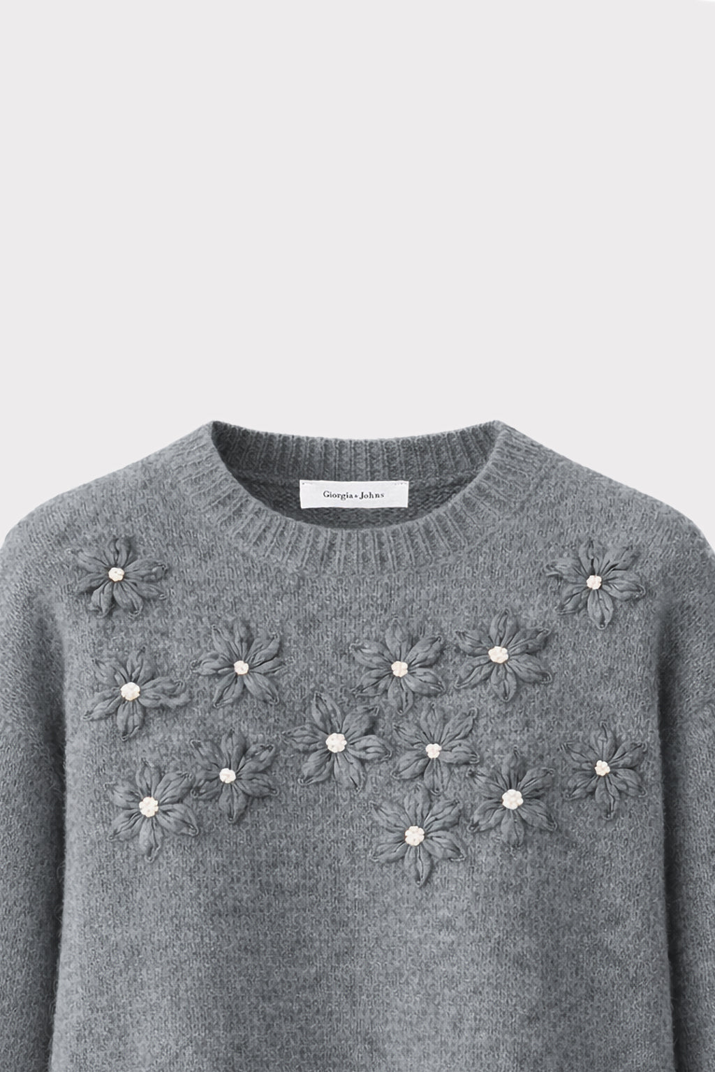 Pullover con ricami