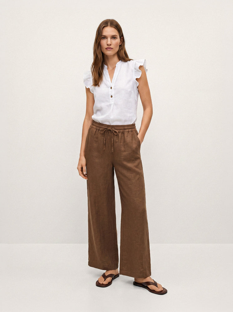 Blusa smanicata in lino con volant