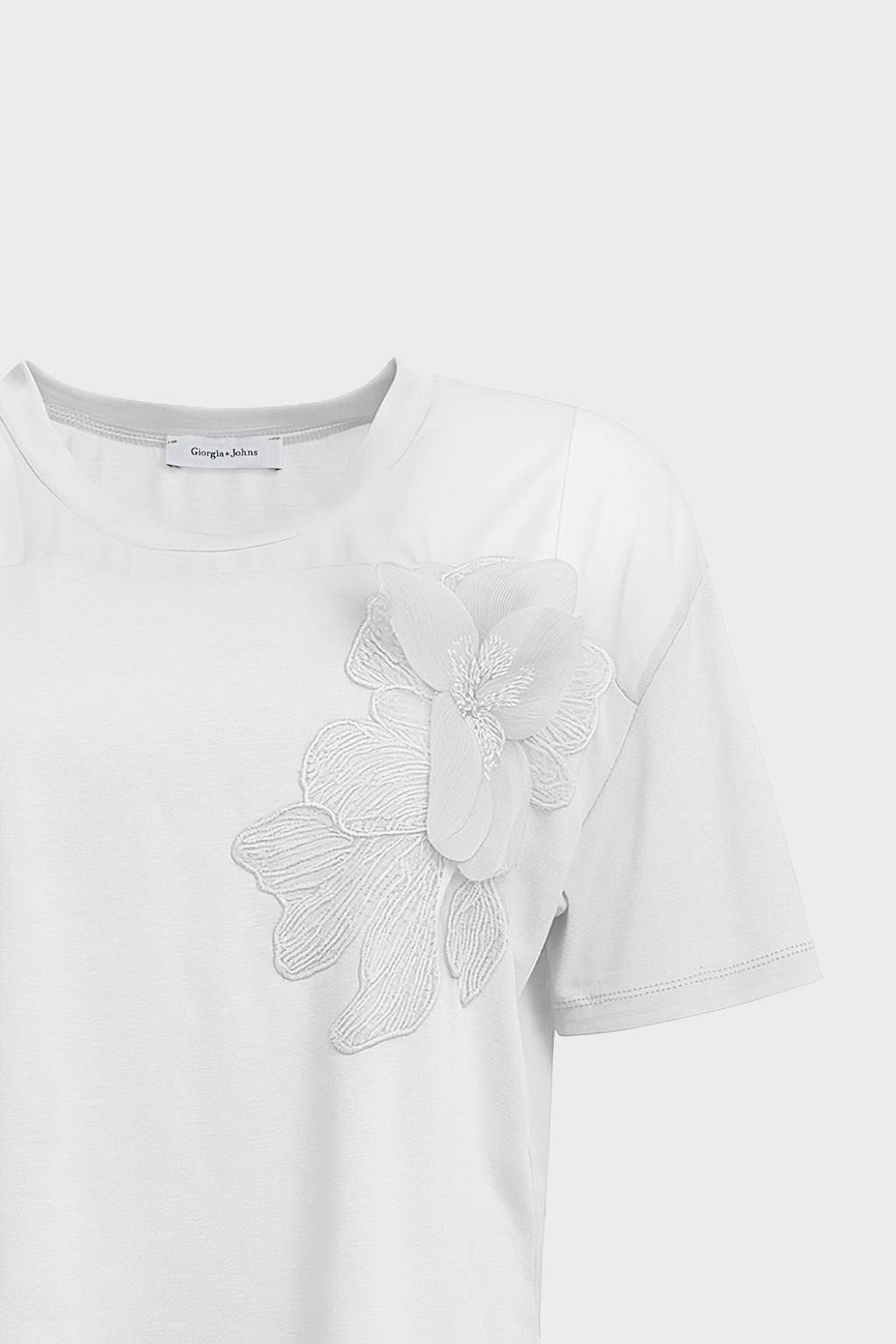 Blusa dettaglio fiore e perle