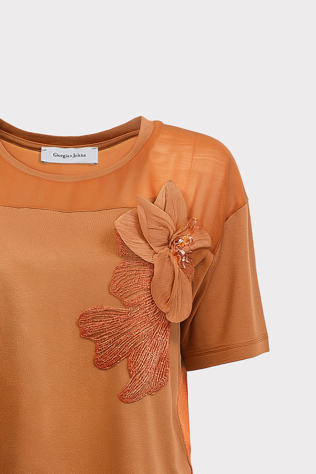 Blusa dettaglio fiore e perle